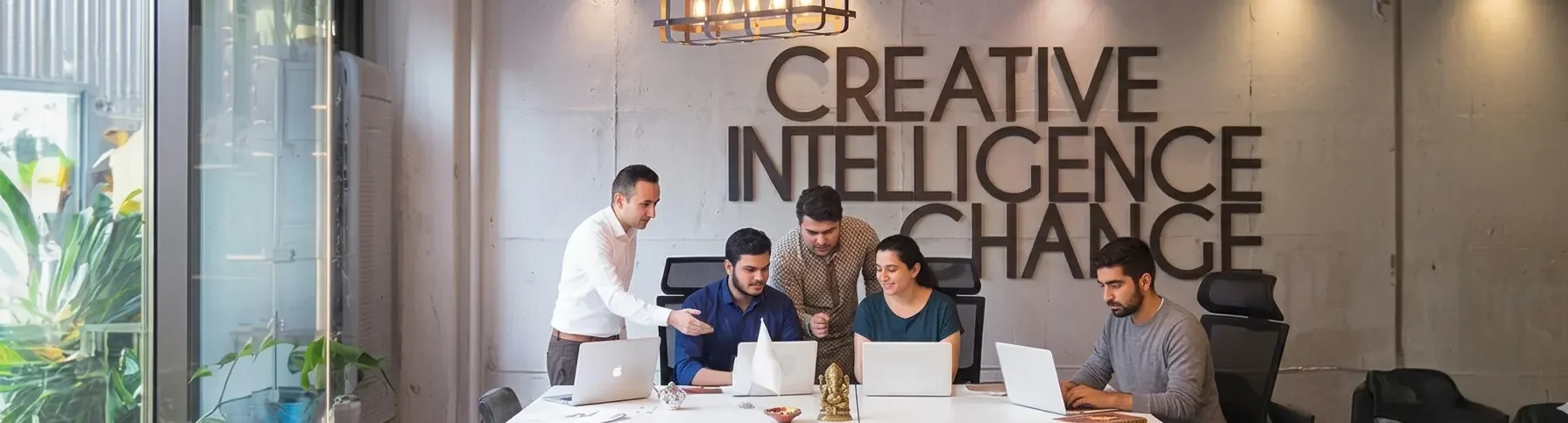 InspireSphere team collaborating around a table in the office